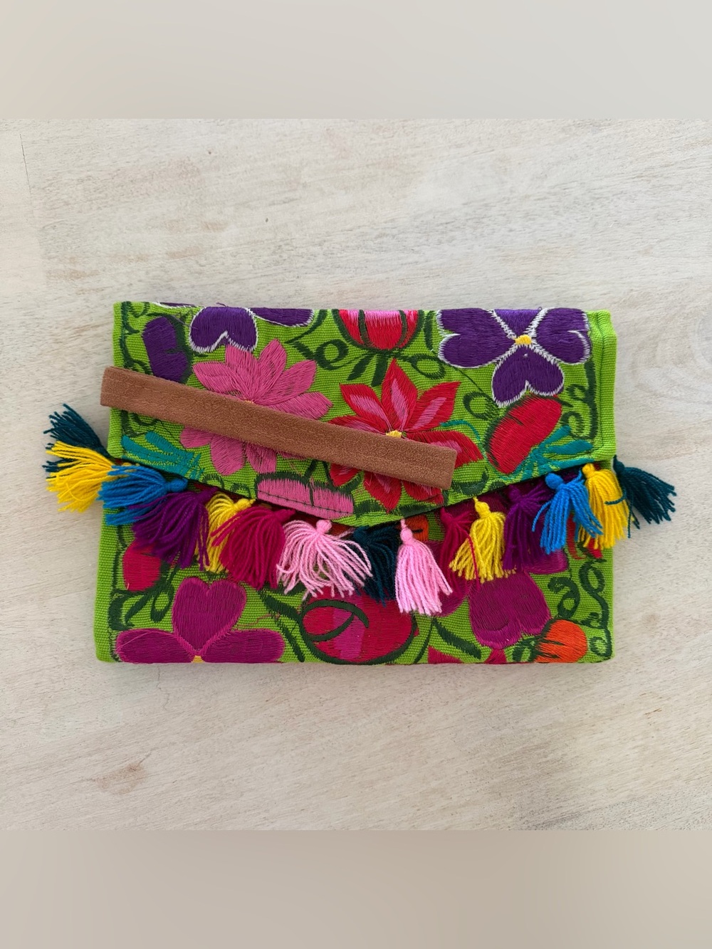 Embroidered clutch with strap